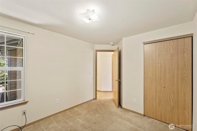8506 8th Ct SE, Olympia, WA 98513 - unfurnished bedroom featuring light carpet and a closet