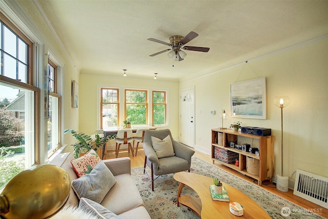 752 N 84th, Seattle, WA 98103 - living area featuring ornamental molding, a ceiling fan, wood finished floors, and a textured ceiling