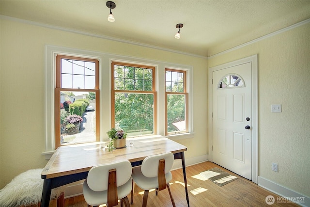 752 N 84th, Seattle, WA 98103 - dining area with light wood-style flooring, ornamental molding, and a textured wall