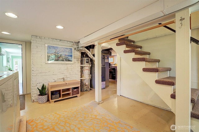 752 N 84th, Seattle, WA 98103 - finished below grade area featuring water heater, stairway, recessed lighting, and a wall unit AC