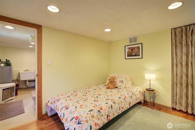 752 N 84th, Seattle, WA 98103 - bedroom featuring wood finished floors and recessed lighting