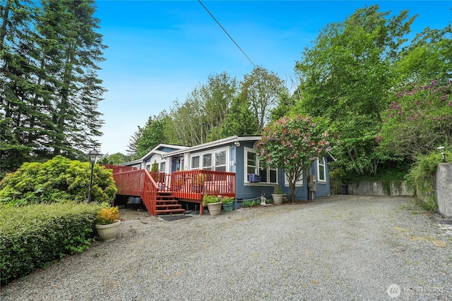 832 Margie Ann Dr, Camano Island, WA 98282 - manufactured / mobile home featuring a wooden deck and driveway