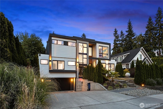 3108 92nd Ave NE, Clyde Hill, WA 98004 - contemporary house with driveway, a garage, and stucco siding