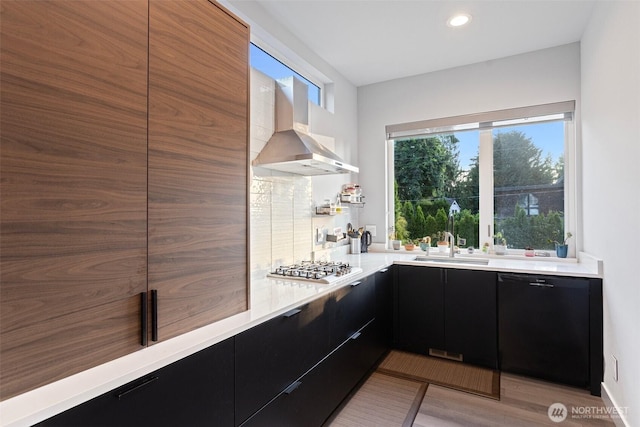 3108 92nd Ave NE, Clyde Hill, WA 98004 - kitchen with dark cabinets, dishwasher, modern cabinets, wall chimney range hood, and light countertops