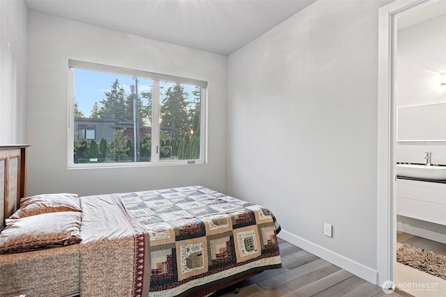 3108 92nd Ave NE, Clyde Hill, WA 98004 - bedroom with wood finished floors and a sink