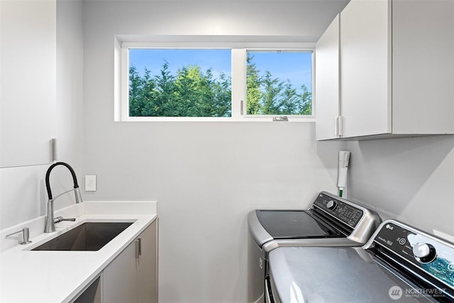 3108 92nd Ave NE, Clyde Hill, WA 98004 - washroom with cabinet space, washing machine and clothes dryer, and healthy amount of natural light