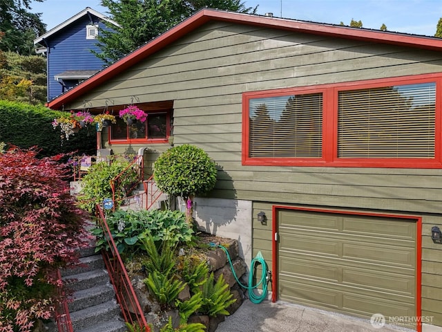 7139 Wright Ave SW, Seattle, WA 98136 - view of front facade featuring an attached garage