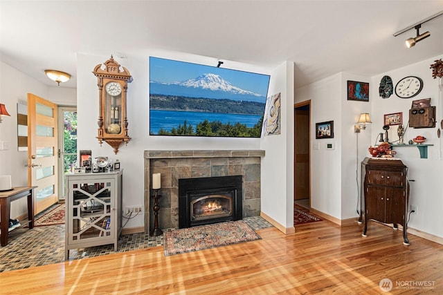 7139 Wright Ave SW, Seattle, WA 98136 - living room featuring wood finished floors and a tile fireplace
