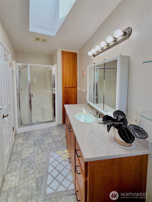 10 Davenhill Ln, Sequim, WA 98382 - full bathroom with vanity, a skylight, and a stall shower