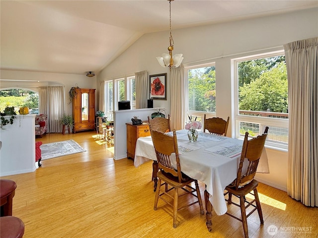 10 Davenhill Ln, Sequim, WA 98382 - dining area featuring a chandelier, light wood-style flooring, and lofted ceiling