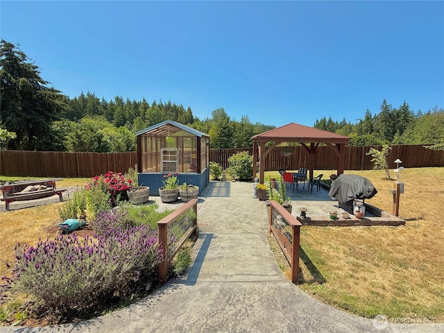 10 Davenhill Ln, Sequim, WA 98382 - fenced backyard featuring a gazebo, an exterior structure, a patio area, and an outdoor structure