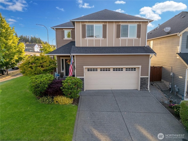 5539 Charlotte Ave SE, Auburn, WA 98092 - traditional-style house featuring an attached garage, driveway, stone siding, and board and batten siding