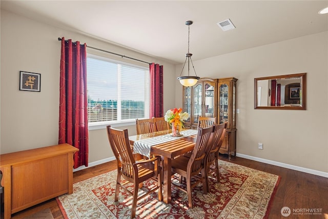 5539 Charlotte Ave SE, Auburn, WA 98092 - dining room featuring baseboards and wood finished floors