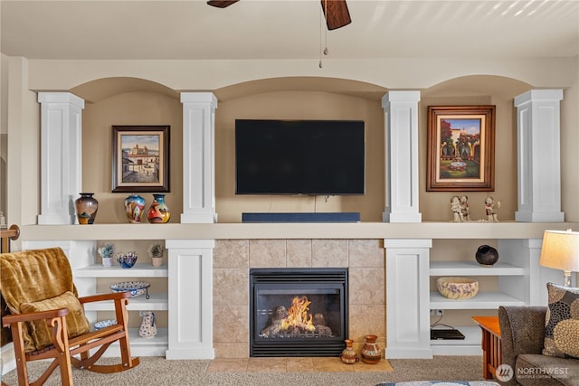 5539 Charlotte Ave SE, Auburn, WA 98092 - living area featuring ornate columns, ceiling fan, and a tiled fireplace