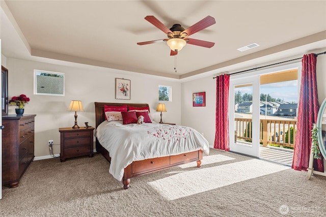 5539 Charlotte Ave SE, Auburn, WA 98092 - carpeted bedroom featuring access to exterior, a raised ceiling, and a ceiling fan