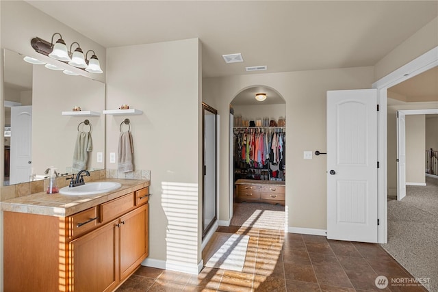 5539 Charlotte Ave SE, Auburn, WA 98092 - bathroom featuring vanity, a spacious closet, and a stall shower