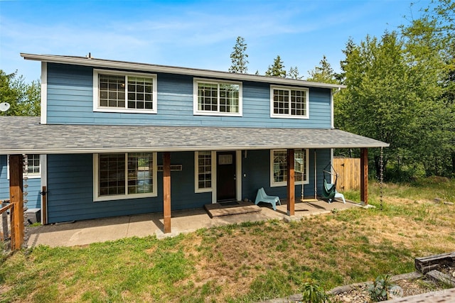 210 E Mossflower Ln, Grapeview, WA 98546 - view of front of property featuring a front lawn and a porch
