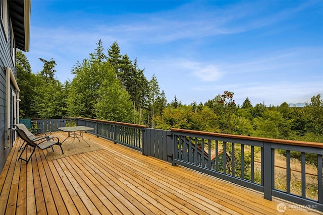 210 E Mossflower Ln, Grapeview, WA 98546 - wooden deck featuring outdoor dining area