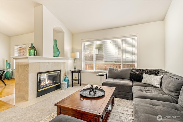 8221 53rd Ave W Unit 15C, Mukilteo, WA 98275 - living area with light carpet, vaulted ceiling, and a tiled fireplace