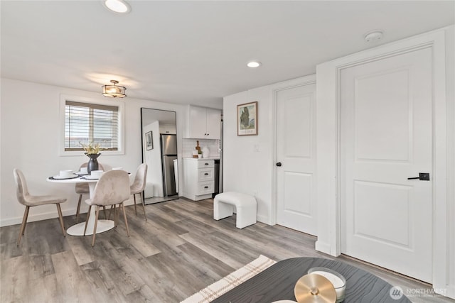 1902 72nd St E, Tacoma, WA 98404 - dining room with light wood finished floors and recessed lighting