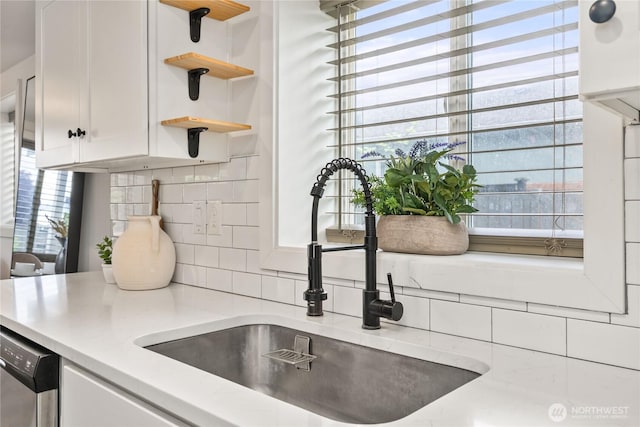 1902 72nd St E, Tacoma, WA 98404 - kitchen featuring open shelves, white cabinetry, backsplash, light countertops, and healthy amount of natural light