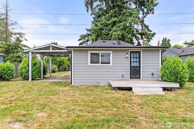 1902 72nd St E, Tacoma, WA 98404 - rear view of property with a wooden deck and a carport