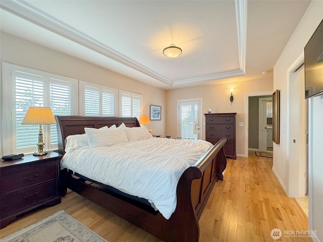 453 Louella Heights Dr, Sequim, WA 98382 - bedroom with a raised ceiling and light wood-type flooring