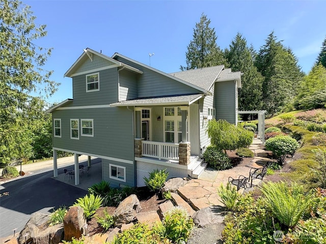 453 Louella Heights Dr, Sequim, WA 98382 - view of front of home with covered porch, driveway, a carport, and roof with shingles