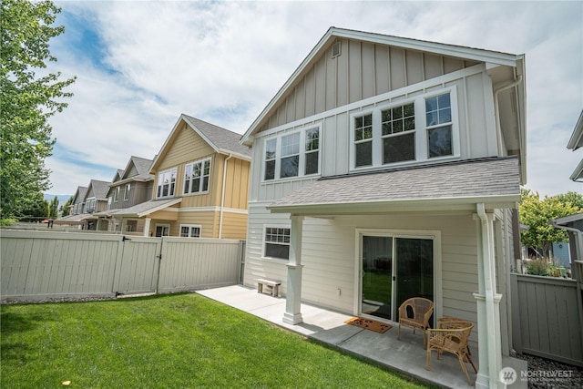 2452 NW Columbia Ave Unit 34, East Wenatchee, WA 98802 - back of house with board and batten siding, a gate, a patio, and a shingled roof