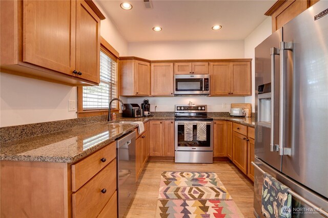 2452 NW Columbia Ave Unit 34, East Wenatchee, WA 98802 - kitchen with stainless steel appliances, light wood-type flooring, recessed lighting, and stone countertops