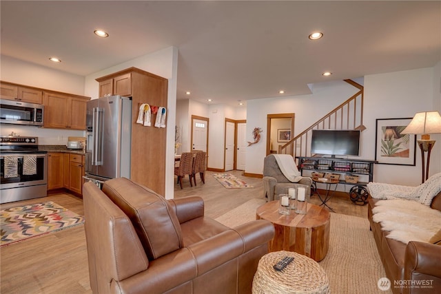 2452 NW Columbia Ave Unit 34, East Wenatchee, WA 98802 - living room featuring recessed lighting, light wood-type flooring, and stairs