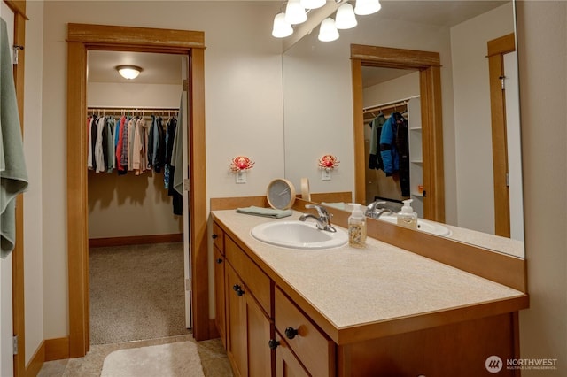 2452 NW Columbia Ave Unit 34, East Wenatchee, WA 98802 - bathroom featuring vanity and a walk in closet