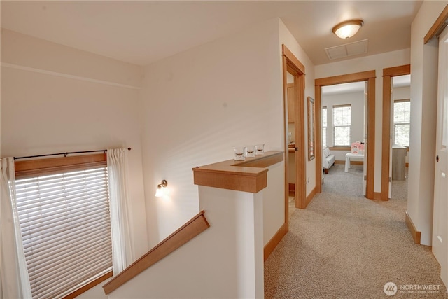 2452 NW Columbia Ave Unit 34, East Wenatchee, WA 98802 - corridor featuring light colored carpet and an upstairs landing