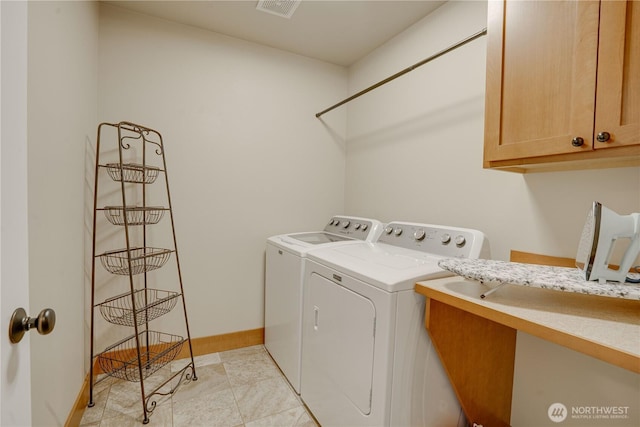 2452 NW Columbia Ave Unit 34, East Wenatchee, WA 98802 - washroom featuring separate washer and dryer and cabinet space