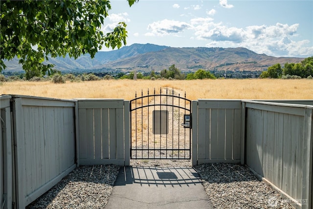 2452 NW Columbia Ave Unit 34, East Wenatchee, WA 98802 - gate featuring a mountain view and a view of rural / pastoral area