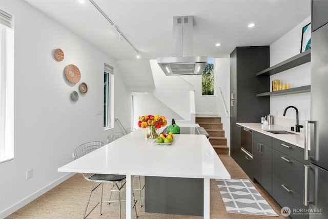 3642A Interlake Ave N, Seattle, WA 98103 - kitchen with exhaust hood, light countertops, open shelves, a kitchen island, and recessed lighting