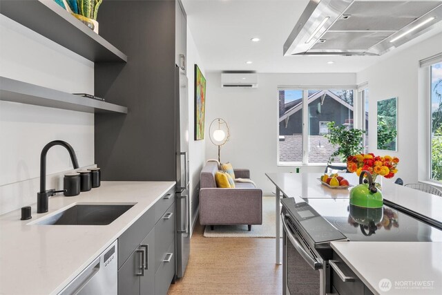 3642A Interlake Ave N, Seattle, WA 98103 - kitchen with an AC wall unit, electric range, light countertops, open shelves, and recessed lighting