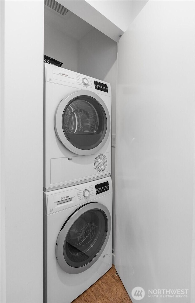3642A Interlake Ave N, Seattle, WA 98103 - laundry area featuring estacked washer and dryer and wood finished floors