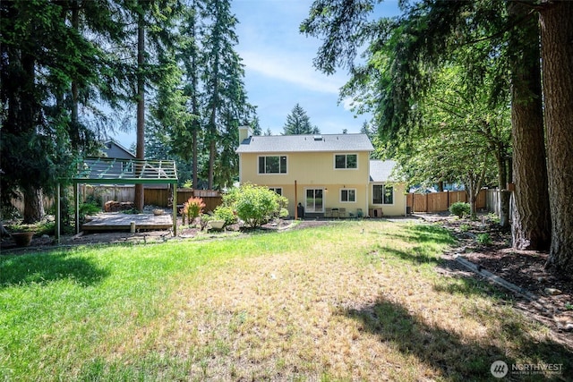11011 203rd Ave E, Bonney Lake, WA 98391 - back of house with a chimney and a wooden deck
