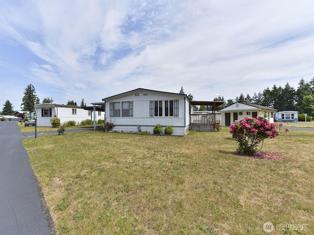 20725 9th Ave E Unit 6, Spanaway, WA 98387 - manufactured / mobile home with a front yard and an attached carport