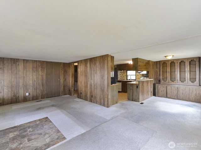 20725 9th Ave E Unit 6, Spanaway, WA 98387 - unfurnished living room featuring wooden walls and light carpet