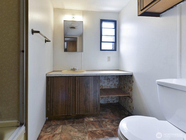 20725 9th Ave E Unit 6, Spanaway, WA 98387 - bathroom featuring stone finish flooring and vanity