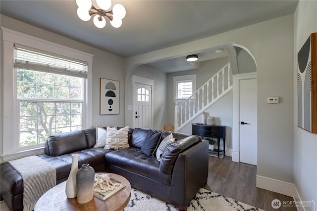 3225 Oakes Ave, Everett, WA 98201 - living area with a chandelier, stairs, arched walkways, and wood finished floors