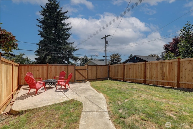3225 Oakes Ave, Everett, WA 98201 - fenced backyard featuring a fire pit and a patio