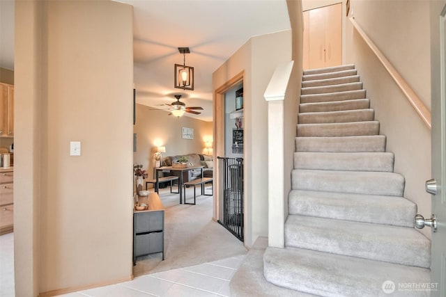 1450 Mountain View Dr, Enumclaw, WA 98022 - stairs with ceiling fan, carpet flooring, and tile patterned flooring