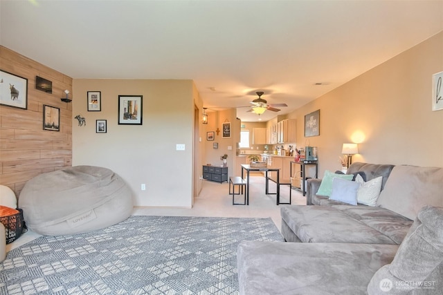 1450 Mountain View Dr, Enumclaw, WA 98022 - living area with wood walls, ceiling fan, and light carpet