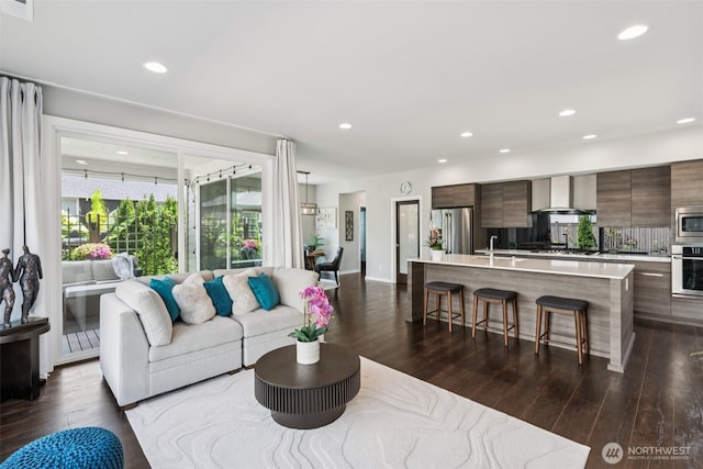 12914 SE 213th, Kent, WA 98031 - living area featuring dark wood-style floors and recessed lighting