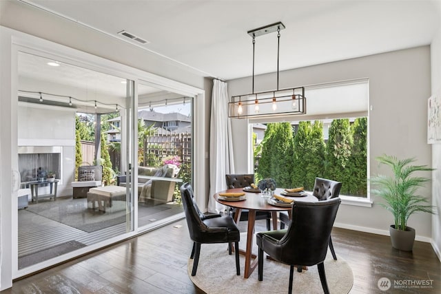 12914 SE 213th, Kent, WA 98031 - dining space featuring wood finished floors and healthy amount of natural light