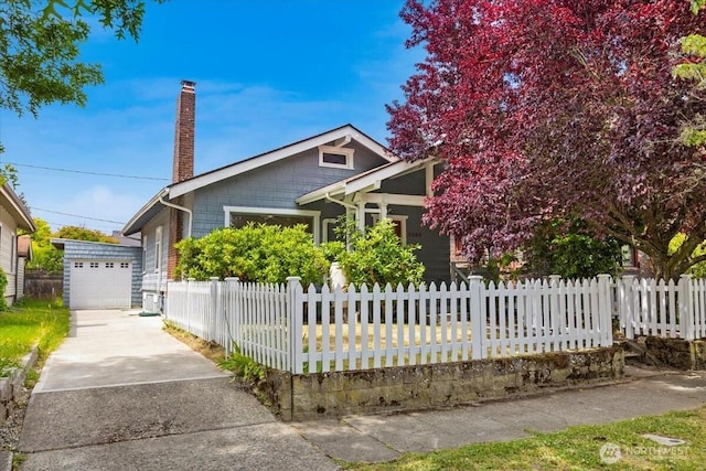 1305 N 6th St, Tacoma, WA 98403 - view of front of property with concrete driveway, a chimney, and a fenced front yard