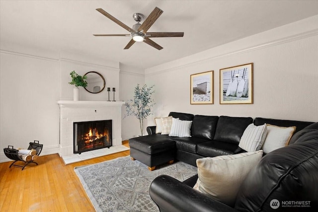 1305 N 6th St, Tacoma, WA 98403 - living area with a ceiling fan, wood-type flooring, and a brick fireplace